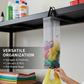 Hanging waste bag holder conveniently placed in a modern kitchen setting.