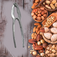 Portable stainless steel nut cracker showcasing its effective pressing grooves.