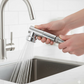 Flexible 1080° swivel feature of the faucet sprayer head in use.