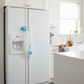 Child safety lock seamlessly installed on a kitchen cabinet door.