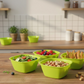 A vibrant set of four square plastic serving bowls in various colours.