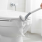 Wall-mounted holder securely storing the golf toilet brush, saving space.