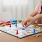 Plastic money coins and colorful game pieces for the business board game.
