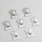 An 18-piece set of self-adhesive stainless steel wall hooks displayed on a white surface.