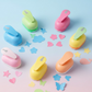 A group of colorful kids paper craft punches with various decorative shapes.