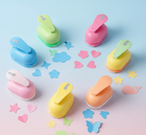 A group of colorful kids paper craft punches with various decorative shapes.