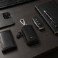 Black PU leather car key case with zipper and metal clip hook.