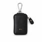 Elegant black PU leather car key case on white background.