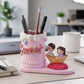 Close-up of romantic couple figurine pen holder