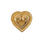 Kumkum holder with white background highlighting golden design