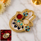 Decorative hand-shaped kumkum holder with enamel detailing for puja