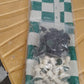 Portable chess set with foldable board and plastic pieces on flat surface