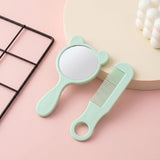 Cute bear-shaped handheld mirror in mint with matching comb in grooming kit