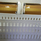 The space-saving organizer placed beside a washing machine, holding laundry essentials.