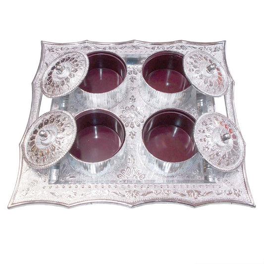 Traditional mukhvas dani with secure airtight lids on a dark background.