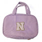 Travel toiletry bag placed on a white background