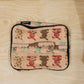 Person holding a compact travel organizer bag, ready for daily use.