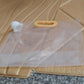 Lifestyle image showing portable airtight food storage bag with handle in kitchen