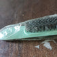 Packaging of the cleaning brush, showing product information.