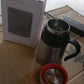 Lifestyle shot of the sleek vacuum insulated mug on a desk.