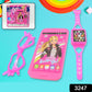 Close-up of the Barbie musical toy phone with a screen displaying a Barbie image and large buttons.
