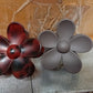 Elegant flower hair clip displayed on soft fabric background