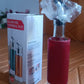 Top view of glass oil dispenser featuring plastic cover and golden pour spout