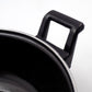Close-up view of cast iron kadai surface highlighting seasoning
