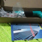 BoltForce manual steel nail gun kit showing the tool, extra nails, and accessories.