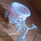 Bicycle plastic flower pot stand displayed in living room setting