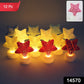 Close up of glowing star shaped LED tealight candles in warm LED light