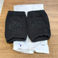 Black toddler wool knee guard shown in use providing knee protection