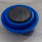 Multiple plastic magnetic buckles in various colors displayed on a whiteboard.