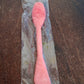 GlowForm's dual-ended silicone mask brush elegantly displayed on a clean white surface.