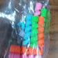 Variety of spiral cable protectors displayed on several electronic cables.