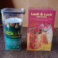 Empty 1700 ML airtight plastic storage container with black clip-lock lid