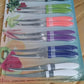 Versatile serrated knife from the 12-piece set cutting vegetables smoothly.