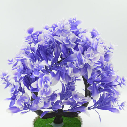 Vibrant artificial flower plant with a white pot, perfect for enhancing home or office desk decor.