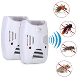 Compact white ultrasonic pest repeller plugged into an electrical outlet.
