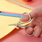 The 3.5-inch folding scissor demonstrating its smooth cutting action.