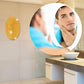 A decorative oval mirror wall sticker applied to a bedroom wall, adding elegance.