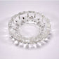 Stylish clear glass ashtray on a tabletop, enhancing home or office decor.