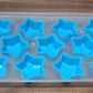 Overhead view of a silicone ice cube tray showcasing various fruit and geometric designs.