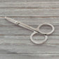 Elegant compact nail clipper set with its clear storage case for easy access.