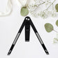 A sleek black foldable tablet stand holding a tablet at an ergonomic viewing angle.