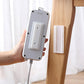 Self Adhesive Plug Organizer on a white wall, neatly holding a power strip.