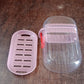 Compact pink plastic soap dish ideal for travel and home bathroom use