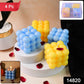 Close-up of wax cube candles showing bright blue and yellow colors