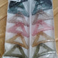 Colorful triangle shaped plastic hair claw clip styled in hair for a chic look