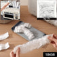 A large dining table covered with a clear disposable furniture protector.
